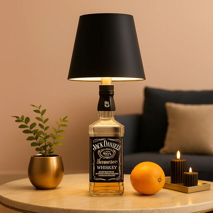 Jack Daniel's whiskey bottle repurposed as a lamp with a black shade on a table. Luxury bottle lamp with USB-C charging and adjustable brightness, designed for premium home and office decor.