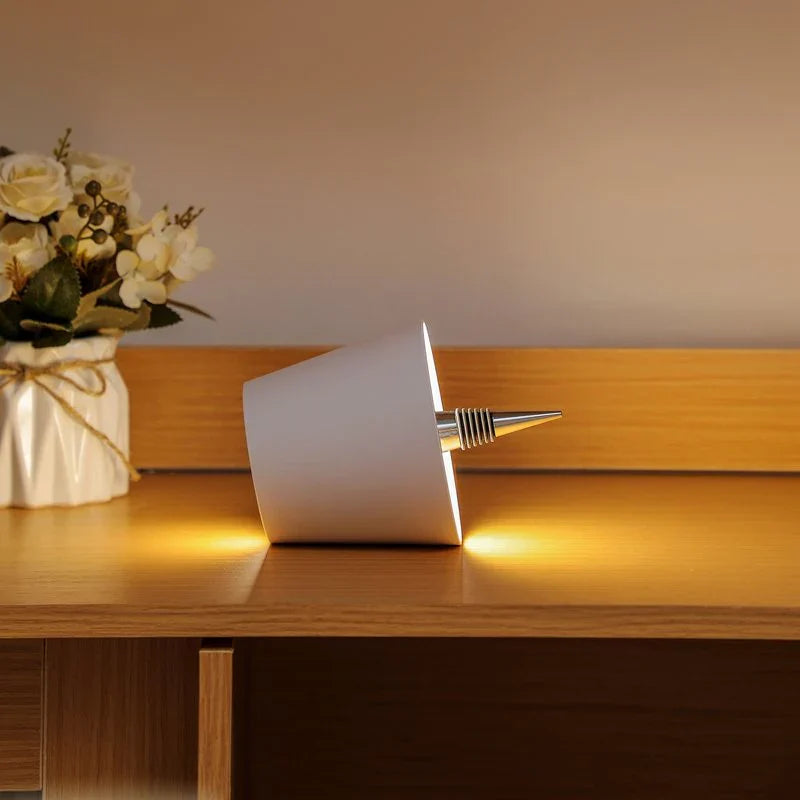 Minimalist LED bottle lamp with touch dimming control and warm 3000K lighting for aesthetic room decor.