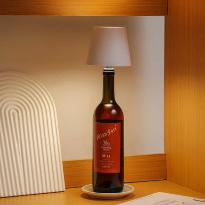 Bottle of wine with a lampshade on a wooden surface
Decorative rechargeable bottle lamp placed on a wooden table with luxury ambient lighting and modern interior styling.